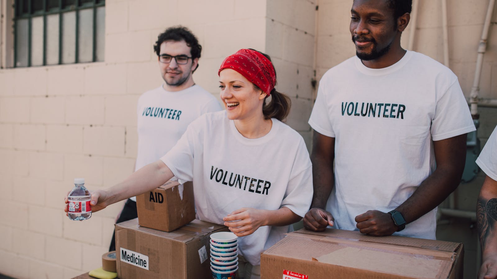 Community members and volunteers supporting migration awareness and social welfare